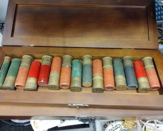 Paper shotgun shells in collectors box.