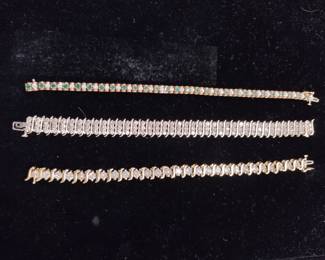 14 karat gold and diamond bracelets, one with emeralds