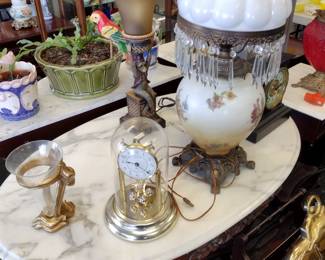 Marble top table. with clocks, lamps and others