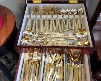 Two sets gold plated flatware.