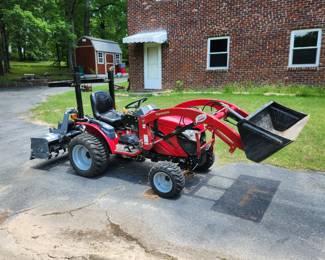 2016 Mahindra HST eMax22, 19.5 total hours.  Being sold with bucket, tiller, brush hog and scraper (see later pictures) for $14,000 (Call 501 545 0248)
