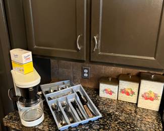 Tin canister set, coffee maker and two sets of flatware.