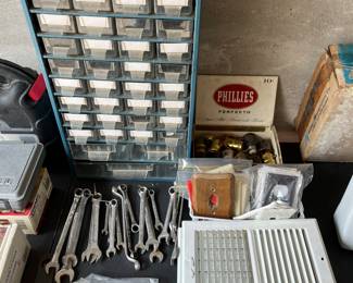 Heat register covers, sets of open and closed end wrenches, light switch covers, vintage knife and hardware storage.