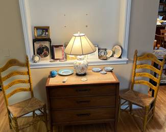 3 drawer chest, ceramic decorative lamp, pair of ladder back chairs with rattan seats, variety of frames and blue/white dishes.