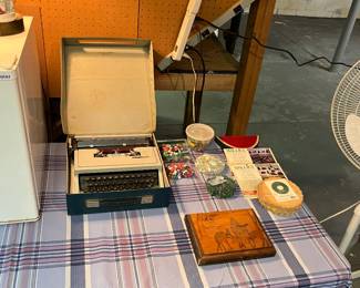 Craft accessories and vintage typewriter.