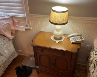 One of a pair of bedside tables, weight scale and end table lamp.