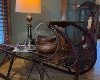 Antique, sleigh coffee table.  Copper baskets,  Stifel brass lamp