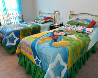 Twin beds with Mickey Mouse comforters