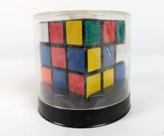 Vintage Rubik's Cube Puzzle Game Includes Original Packaging and English, German, and French Instructions Booklet
