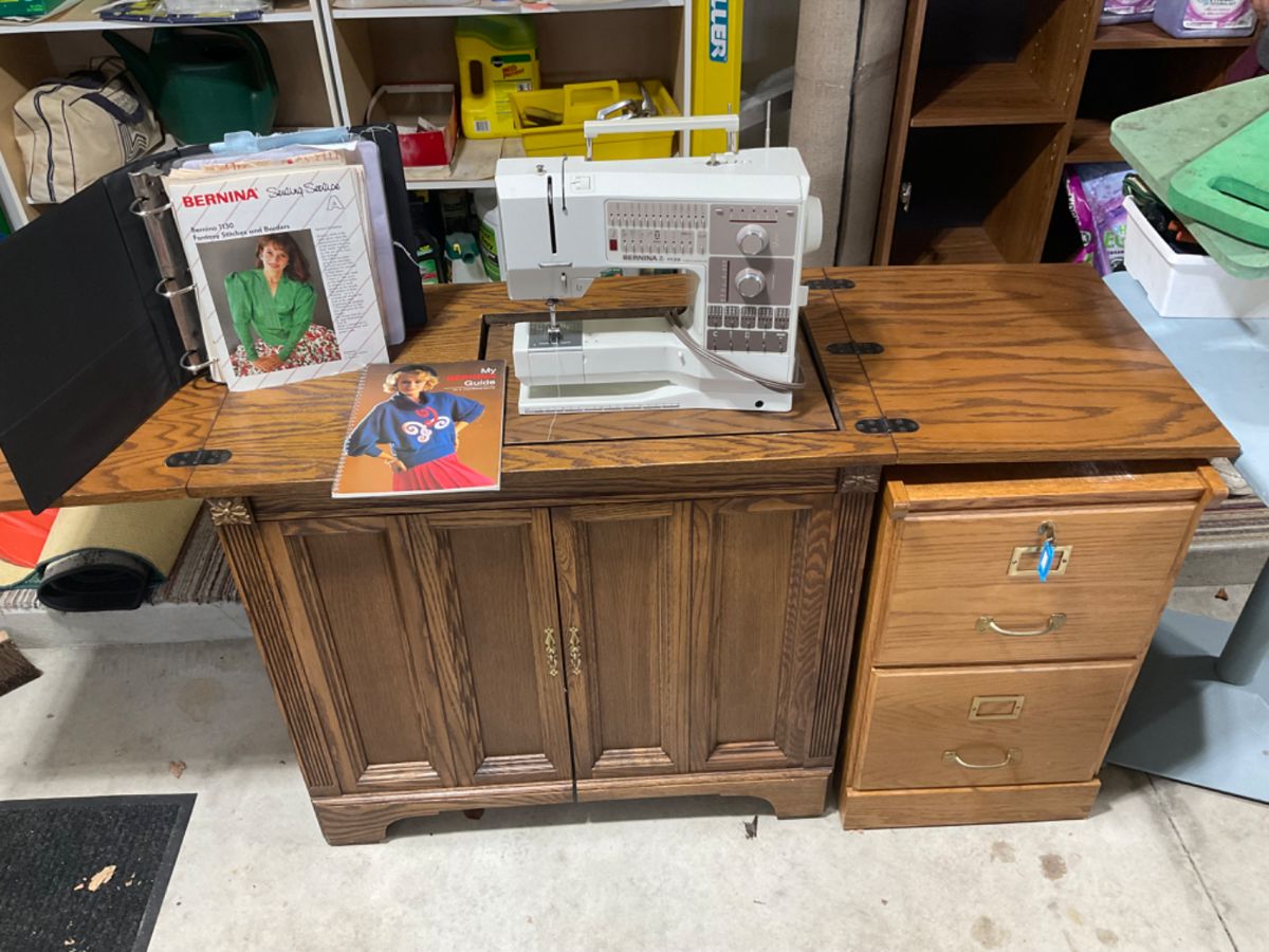 Bernina 1130 Sewing Machine with accessories & lots of spool threads, etc. Lower right is a separate wooden file.