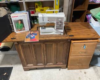 Bernina 1130 Sewing Machine with accessories & lots of spool threads, etc. Lower right is a separate wooden file.