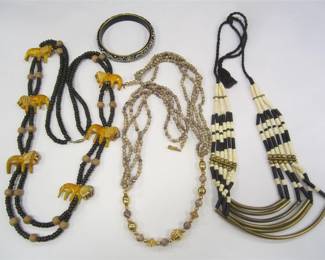 THREE ETHNOGRAPHIC NECKLACES, BONE, AND CARVED LION FIGURES