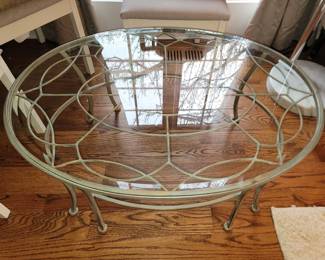 Oval coffee table with a verdigris patina