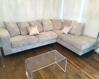 Clear acrylic lucite coffee table. Sofa sectional in light gray microsuede. Sectional 72 + 34 = 106"w
Chaise 34 +44 = 78"w