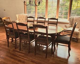 Dining Table with eight chairs and three leafs. Breaks down to a small round table