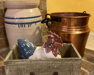 crock, copper pot, and carved chicken