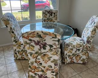 (was 395.00)Now $150 !!!! (4/7)  wicker glass table with 4 botanical upholstery chairs 44 round 29 high