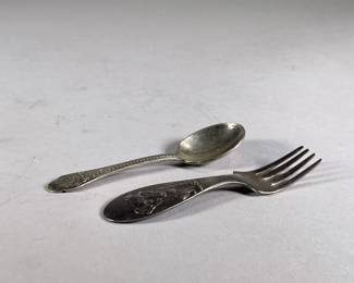 (2PC) PAIR WINTHROP SILVER PLATE BABY UTENSILS | Includes; baby fork with stamped puppy marked on back “Winthrop Silver Plate” and Gerber baby spoon marked on back “Winthrop Silver Plate / Gerber’s”