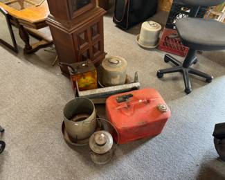 Chicken feeders, gas can and office chair