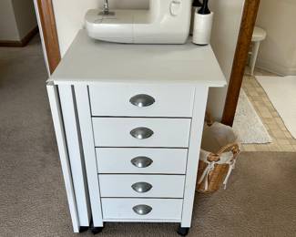 Sewing system, Side extends up to create a desk.