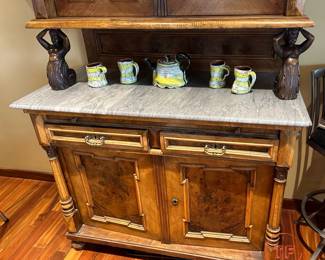 Antique Sideboard with Glass Curio Cabinet Supported by Carved Figural Pillars on Marble Top Server