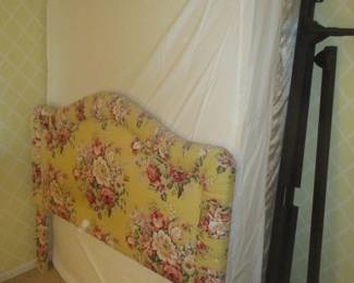 floral upholstered headboard, box spring and mattress