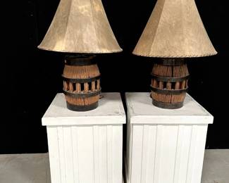Antique wagon wheel hub lamps with rawhide shades. Very unique!