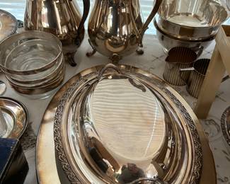 Silverplate teapots, platters, serving dishes