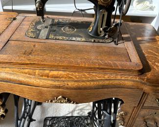 Old Volo sewing machine in cabinet