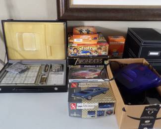 Games and Purple Nintendo 64 with controllers and games