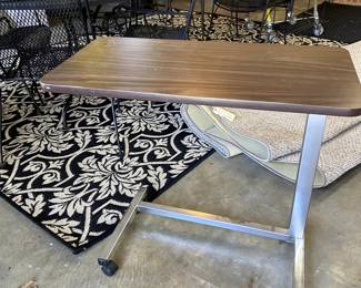Rolling tray table and another huge rug that makes for a safe garage floor.