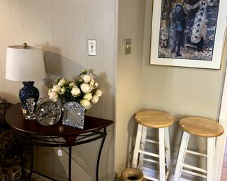 Modern side table, barstools, large decorative vase.
