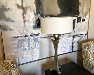 Modern side table with tall lamp. The huge abstract print fill a wall in style :-)