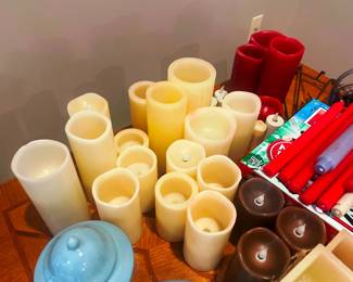 A large collection of battery operated candles
