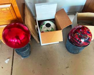 There is a collection of glass gazing balls here at this sale, this picture shows only 3