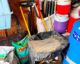 a collection of aluminum baseball bats, Louisville Sluggers! Base balls and gloves too.