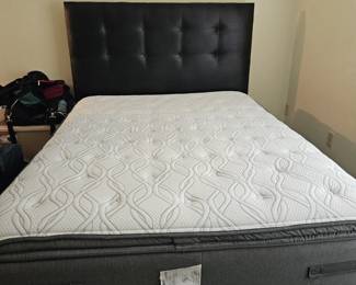 Almost new queen bed wish black vinyl headboard, and metal frame $200