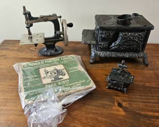 Vtg Antique Mini Singer Toy Sewing Machine W/Book, 
Vtg Die Cast Queen Stove Pencil Sharpener & Mini Cast Iron Stove!