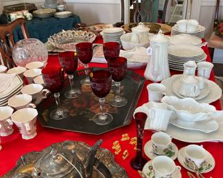 TABLE FULL OF GLASS AND CHINA