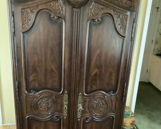 A NICE-LOOKING ENTERTAINMENT CENTER/WARDROBE OR FUTURE BAR TO BE 