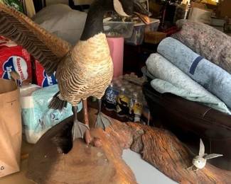 Wood carving of goose and small bird
