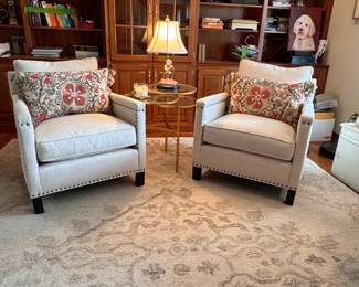 Pair of Pottery Barn Tyler oatmeal linen chairs, brass nail accents, foam and down cushions, includes accent pillows 33"H x 30"W