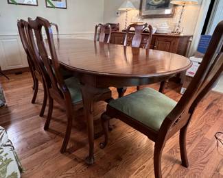 Henkel-Harris Wild Black Cherry dining table with six chairs, two 16" leaves with covers, felted table pads, some scratches to top, some mild spots to seats, 34 in. W x 6ft L (seen with 1 leaf inserted) 