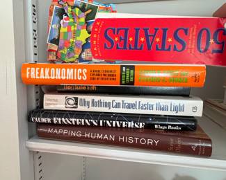 Group of books including Freakonomics