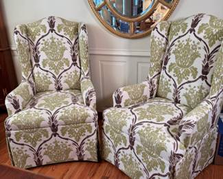 Pair of skirted wingback chairs, with pale green and brown fabric, firm seats 42"H x 26"W