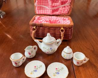 Miniature floral tea set in basket