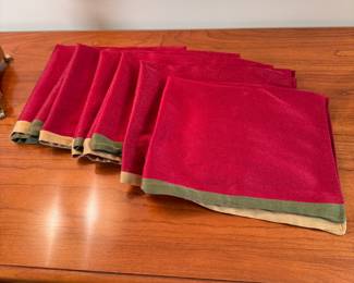 Dark red cloth napkins with gold and green border, some wear