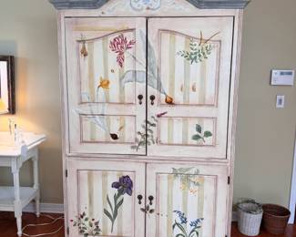 Tall wood wardrobe/TV cabinet with custom floral design by Pat Bibbe some wear, upper doors retract inside cabinet (this item is large and upstairs) 6'6"H x 4'W