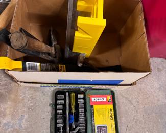 Box of small tools including wrench, Stanley wonder bar, hatchets, miter saw