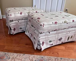 Pair of floral ottomans with matching offwhite slipcovers (with some tears), all show some wear and mild spotting 16"H x 28"W x 19"D (in upper level)